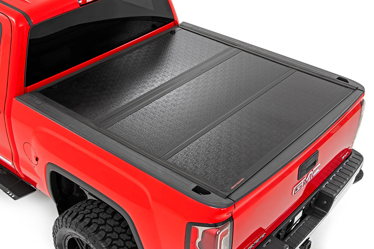 Rough Country Low Profile Hard Tri-Fold Tonneau Cover 14-18 1500, 15-19 2500/3500 HD 5.5 Foot Bed w/Rail Caps